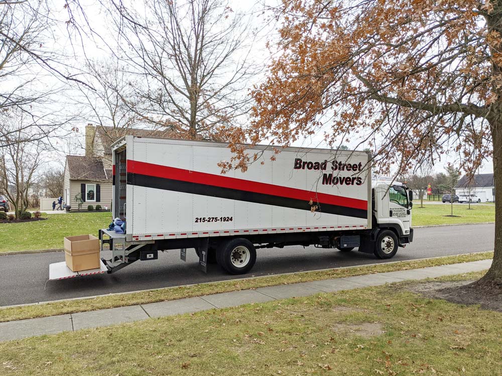 A Broad Street Movers truck being unloaded in a nearby Philadelphia suburb to complete a residential Philadelphia move.