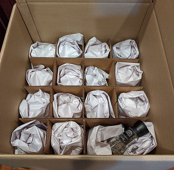 Fragile glassware carefully packed into a box by Philadelphia’s best movers.