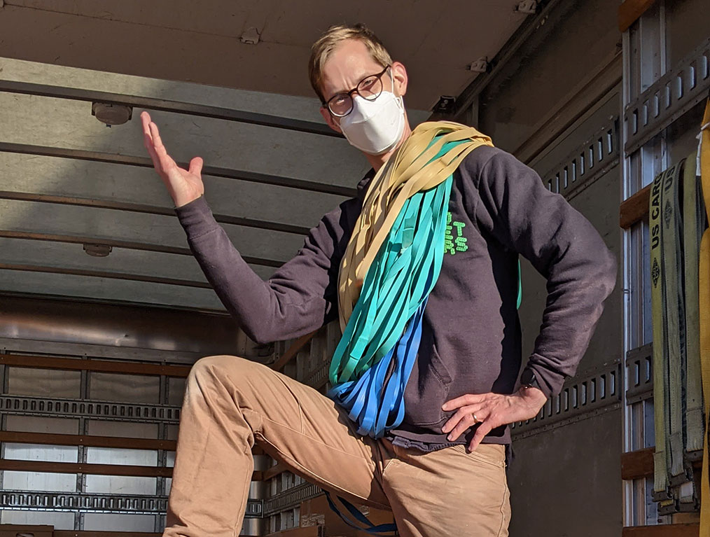 A top-rated mover from Broad Street Movers displaying a properly loaded truck, as well as the ties used to secure furniture while providing local Philadelphia moving services.
